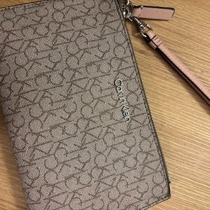 Calvin Klein Taupe Monogram Wristlet with Pink Strap